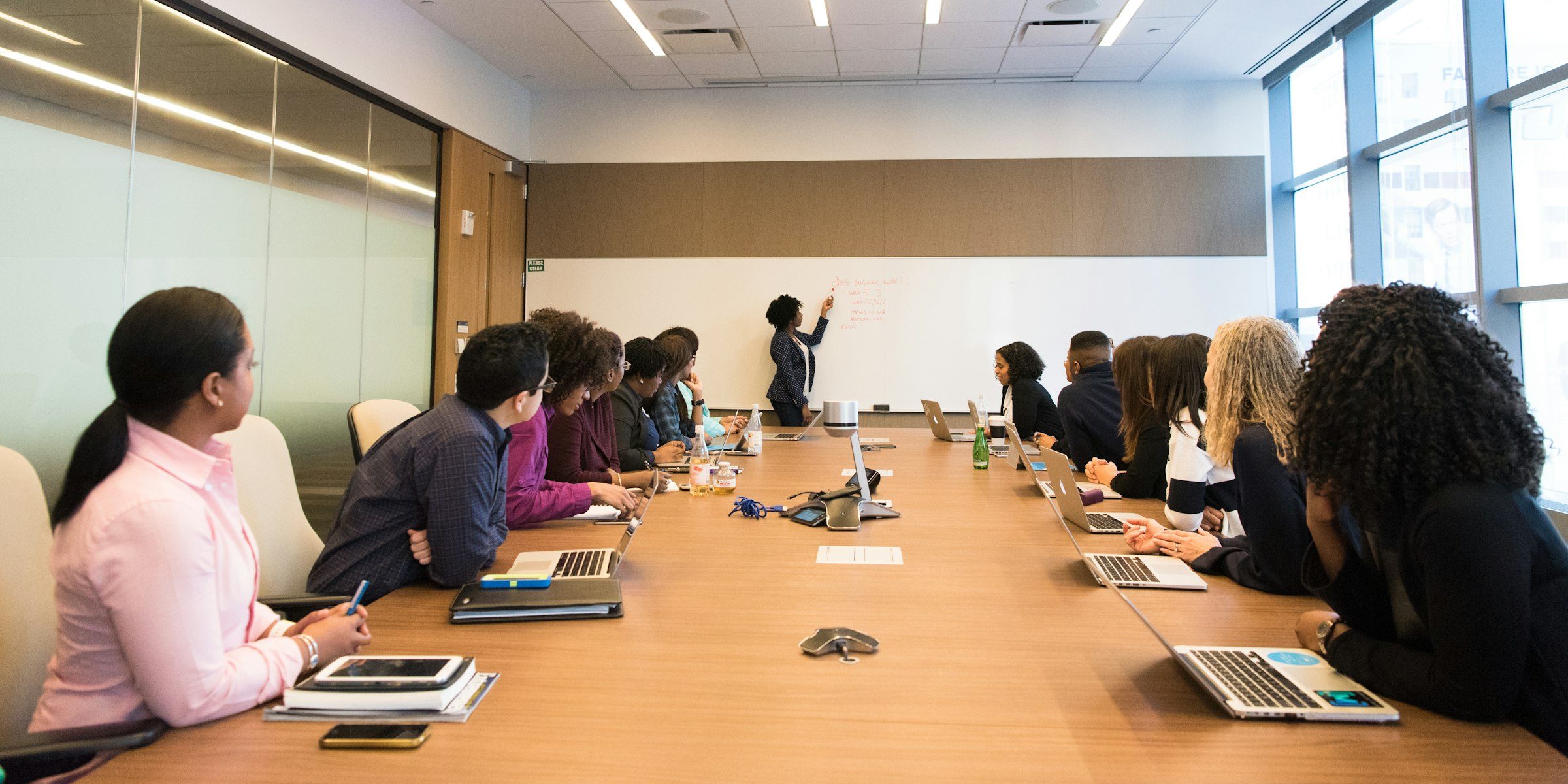 A room of executives working through a session together